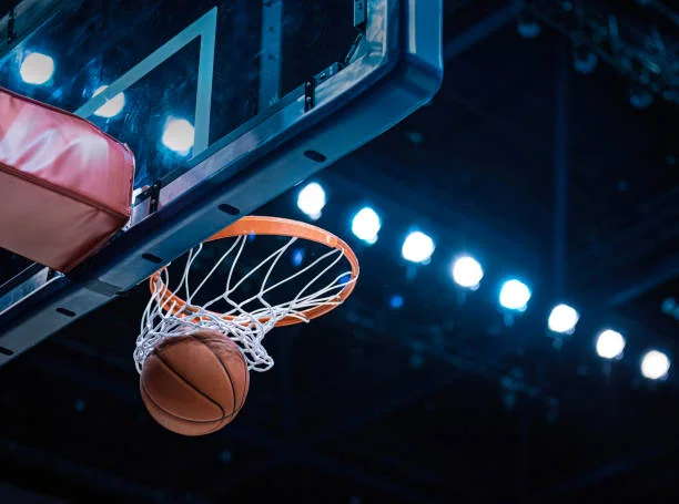 Basketball hoop from below with dramatic lighting
